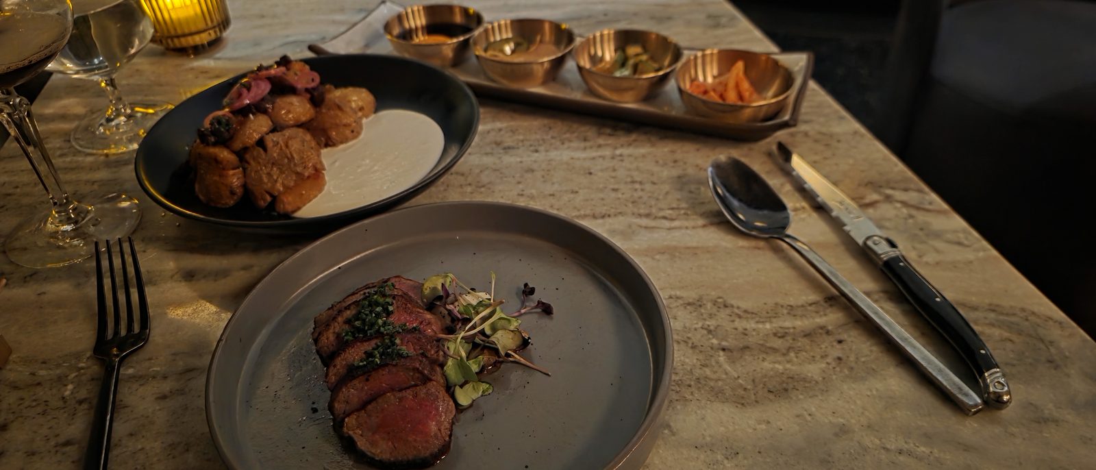 A candlelit table set for dinner